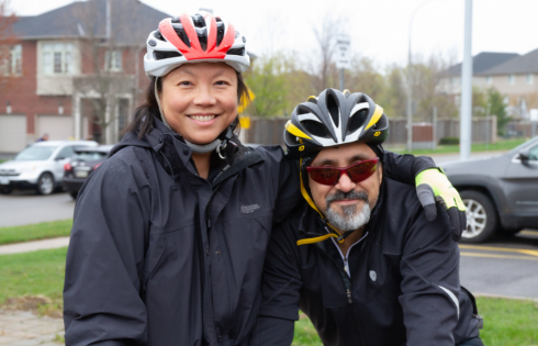 Dr. Bobby Shayegan in his cycling gear with his colleague